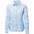 The NB45F shirt by Nimbus is a light blue button-up with long sleeves and a collar, showcased against a white background.