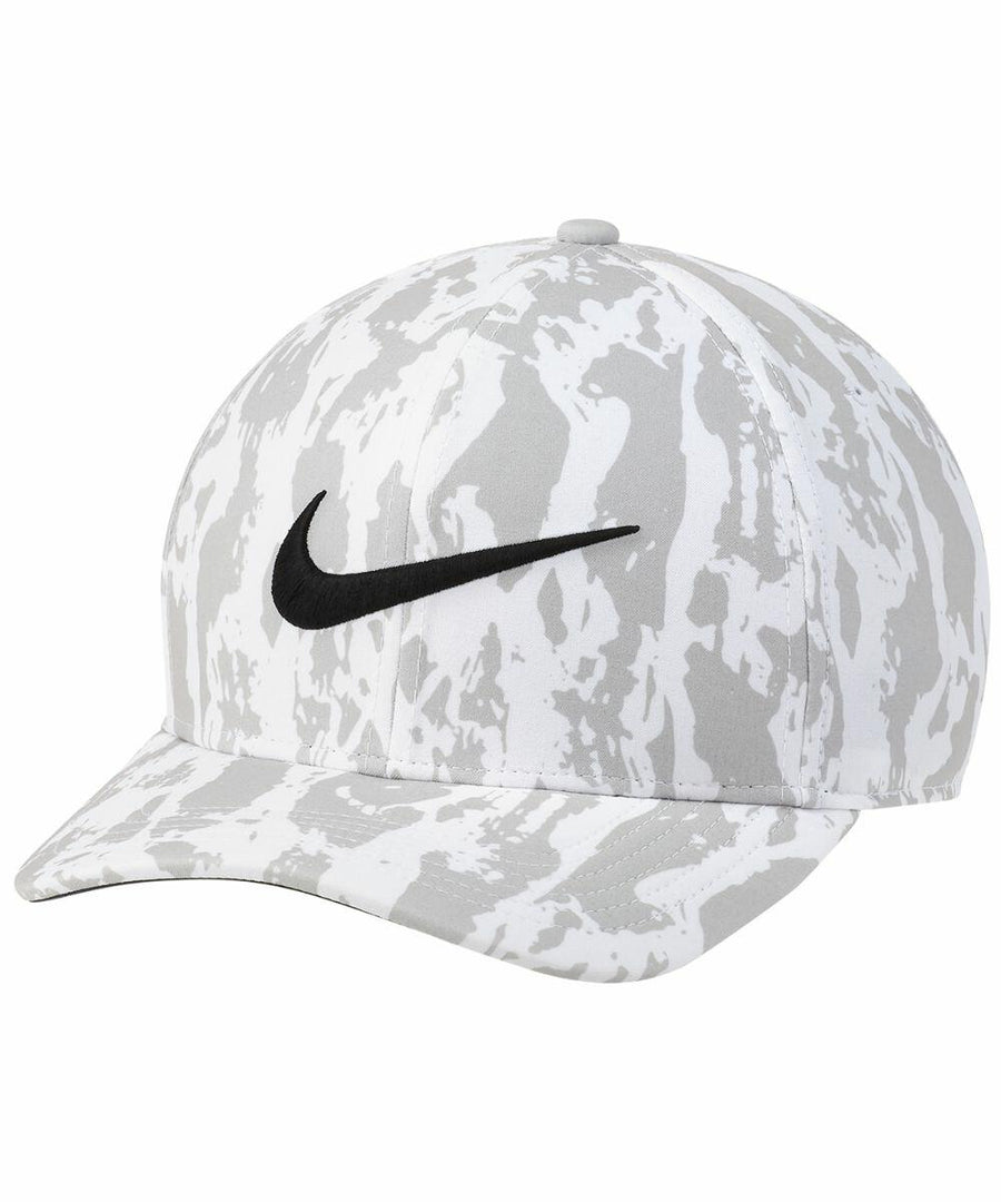 A gray and white camouflage-patterned baseball cap with a black Nike swoosh logo on the front from the Nike NK325 collection.