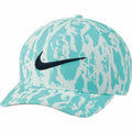 Nike's NK325 baseball cap features a turquoise and white pattern with a black logo on the front.