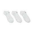 Three Nike NK360 ankle socks in white, each featuring a black swoosh logo, arranged side by side against a white backdrop.