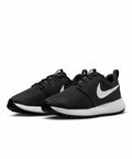A pair of black Nike NK382 running shoes with white swooshes, black laces, and white soles. The shoes are positioned at an angle.