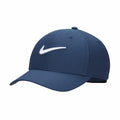 A Nike NK385 cap featuring a navy blue color with a white swoosh logo on the front.