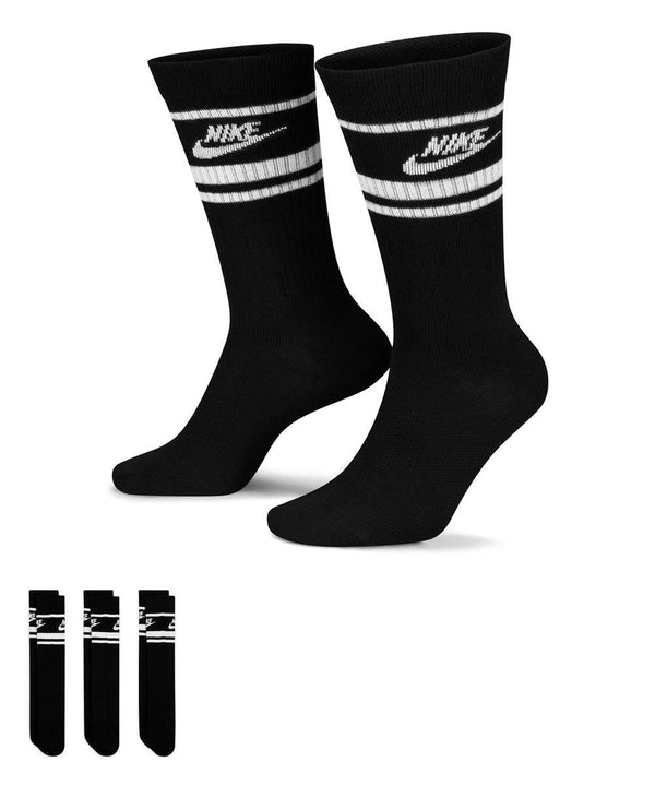 A set of Nike Dri-FIT Sportswear Everyday Essential Socks (3 pairs) in black with white stripes and the Nike logo near the top are shown, with three extra folded pairs displayed in the bottom left corner.