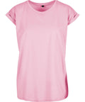 A plain light pink T-shirt with a round neckline and folded short sleeves is displayed on a white background.