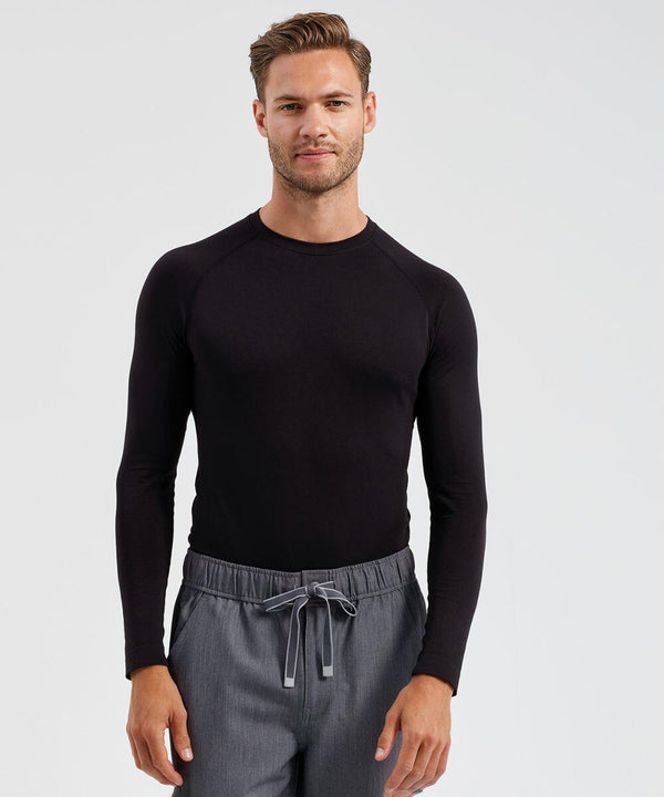 A man wearing a long-sleeved black Onna NN270 shirt and gray drawstring pants stands against a plain background, looking at the camera with a neutral expression.