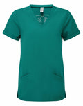 NN310 by Onna by Premier is a green short-sleeve scrub top with a V-neck and folded cuffs, featuring two front pockets as well as an inner label that includes washing instructions and care symbols.