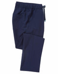 NN500 navy blue scrub pants by Onna by Premier, featuring an elastic waistband and a side pocket, neatly folded.