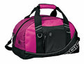 A pink and black OG010 duffel bag by Ogio, featuring black straps, a front zippered pocket, and a side logo.
