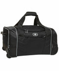 An Ogio OG014 with wheels, featuring multiple compartments and a zippered front pocket. The OG014 has sturdy handles and a retractable handle for easy carrying or rolling.