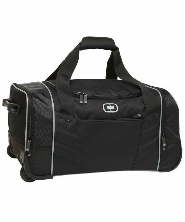 An Ogio OG014 with wheels, featuring multiple compartments and a zippered front pocket. The OG014 has sturdy handles and a retractable handle for easy carrying or rolling.