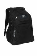 A black OG027 backpack featuring multiple zippered compartments, padded shoulder straps, and the Ogio logo displayed on the side.