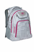 OG027 by Ogio is a gray and pink backpack featuring multiple zippered compartments and a padded shoulder strap.