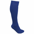 A lone Kariban Proact PA016 knee-high sock, in solid blue, is displayed against a simple white background. The profile view captures its ribbed texture and elastic cuff at the top.