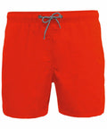 Bright red PA168 swim trunks by Kariban Proact with an elastic waistband and a black and white drawstring at the front.