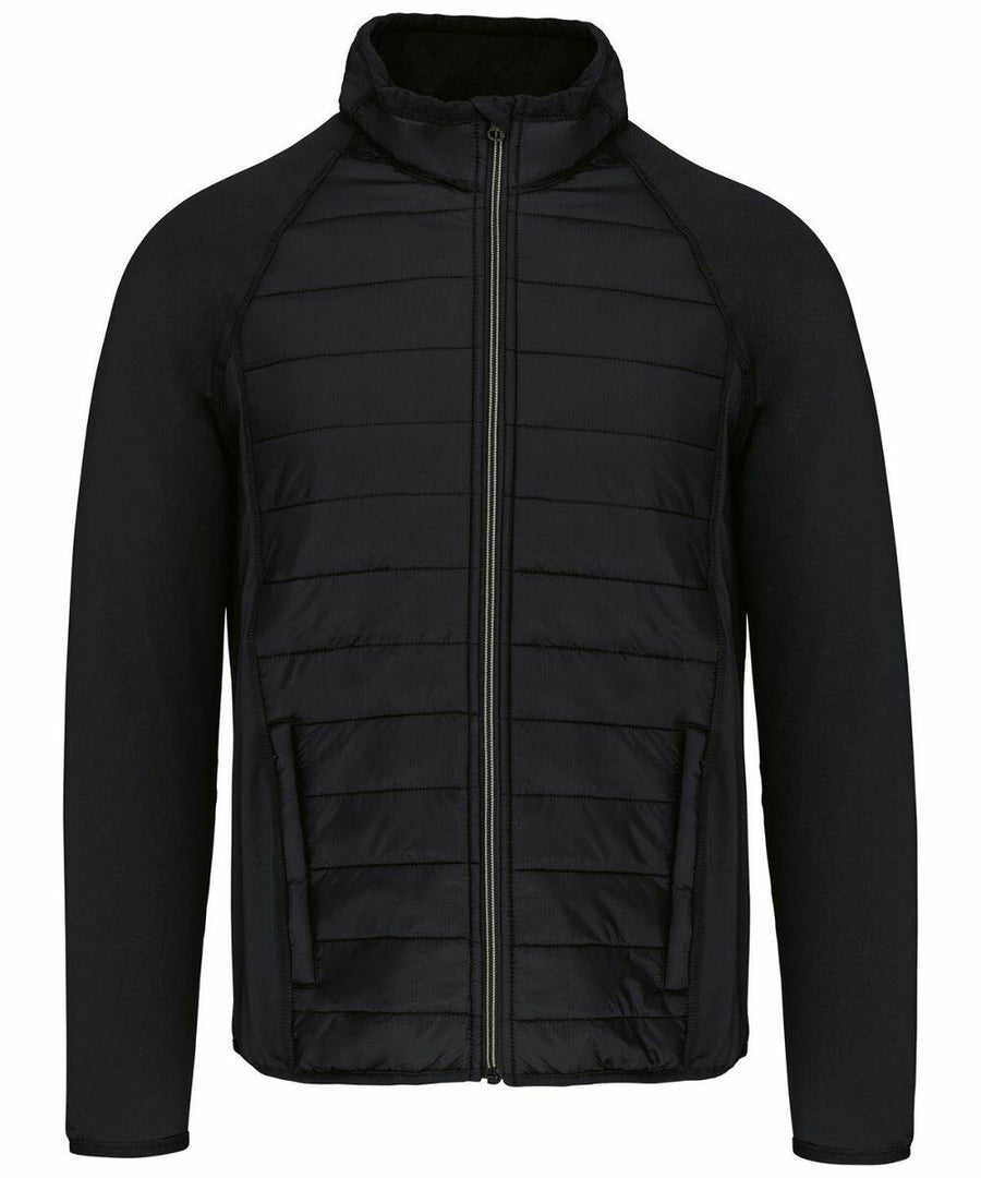 A black zip-up jacket with a quilted front and sleeves made of a different fabric. The product name is PA233 by Kariban Proact.