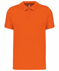 A Kariban Proact PA482 orange short-sleeve polo shirt with a three-button placket and a folded collar displayed against a plain background.