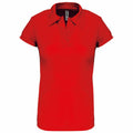 A tailored fit women's PA483 red short-sleeve polo shirt by Kariban Proact, featuring a collar and a v-neck opening, presented on a white background.