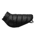 A Dog Jacket in black with quilted, padded fabric is displayed flat on a white background, featuring a circular leg opening and adjustable back straps.