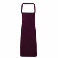 Premier's PR102 maroon apron, featuring a neck strap and long hem, showcased against a white background.