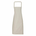 The PR102 apron by Premier is a plain beige design featuring a neck loop and long length, presented against a white background. It boasts a simple and clean aesthetic.