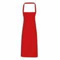 Premier's PR102 apron is a simple red design featuring a neck strap and extended waist ties, showcased against a white backdrop.