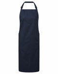 Premier's PR120 black apron features a neck strap and two pockets, displayed against a white background.