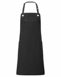 Premier's PR121 black apron features an adjustable neck strap, two side pockets, and a front zipper pocket.