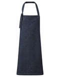 A Premier PR122 dark blue denim apron, featuring a tie on the left side, is displayed against a white background.