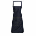 Premier PR126 apron in dark denim featuring a front pocket and an adjustable neck strap.