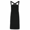 Premier PR129 apron featuring cross-back straps and a spacious front pocket in black.