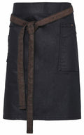 Premier's PR135 denim skirt features a stylish dark wash, complemented by a front pocket and an elegant brown tie belt.