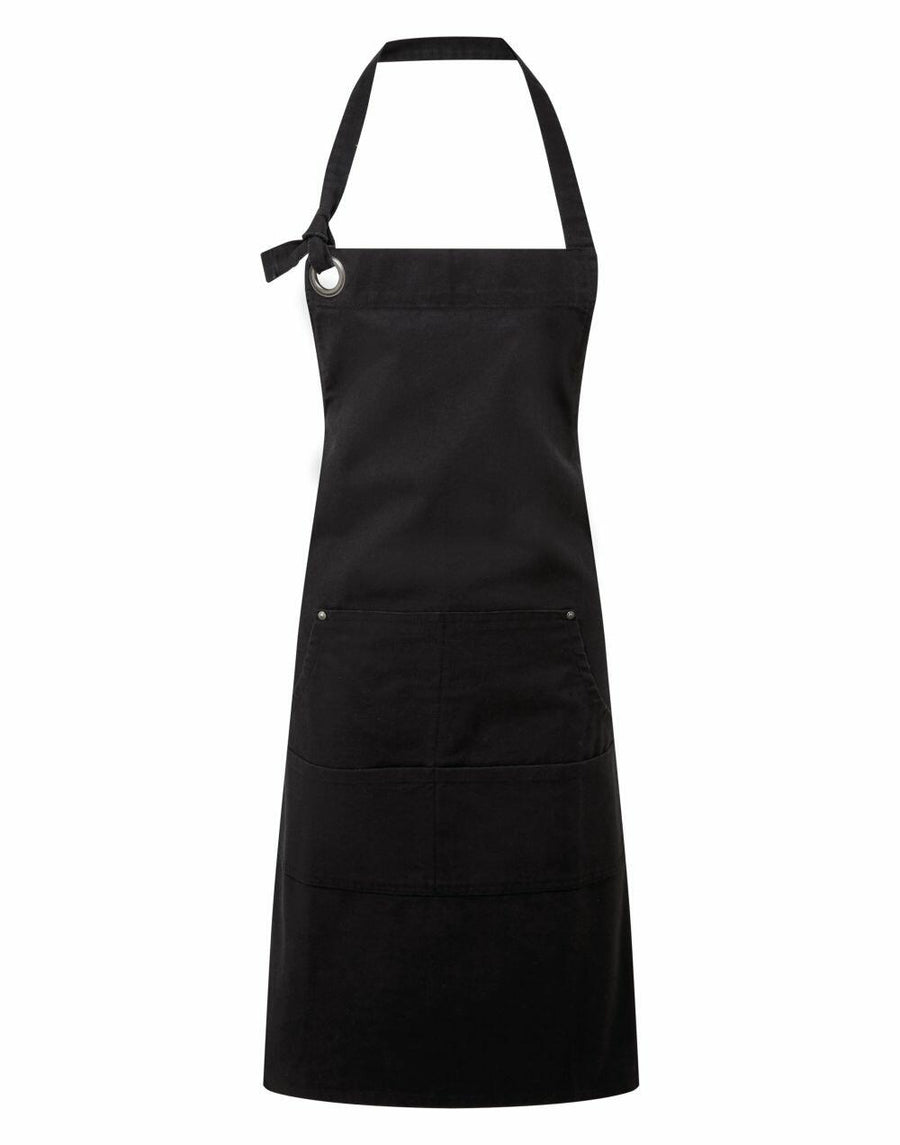 The Premier PR137, a black apron featuring an adjustable neck strap and a large front pocket, is displayed against a plain white background.