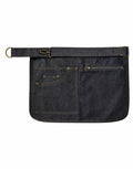 The Premier PR138 is a dark denim apron featuring an adjustable strap, a large pocket, and a zippered compartment.