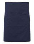 The Premier PR141 is a navy blue apron featuring a large front pocket. It has a rectangular design and is crafted from smooth fabric, making it ideal for cooking or crafts.
