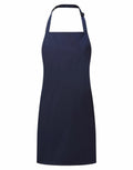 The Premier PR145 apron is a simple navy blue design featuring a neck strap and waist ties, presented against a white background.