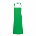 The Premier PR149 is a full-length green apron featuring a neck strap and a clean, simple design. This apron is devoid of any pockets or patterns and is showcased against a plain white background.