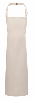 Product PR149 by Premier is a plain beige apron featuring an adjustable neck strap and long ties. Its minimalist design, without pockets or patterns, makes it suitable for kitchen use or crafts.