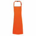 PR149 by Premier features a vibrant orange apron equipped with both a neck strap and waist ties, showcased against a simple white background.