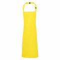 The Premier PR149 apron comes in a bright yellow color, featuring a neck strap with an adjustable buckle. The fabric is smooth, and it provides full coverage with its simple and functional design.