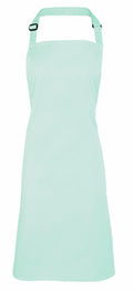 A Premier PR150 apron in mint green, featuring an adjustable neck strap, showcased on a white background.