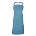 A blue denim apron from Premier, model PR150, featuring a neck strap and offering long coverage, displayed against a white background.