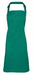 A Premier PR150 green apron featuring a neck strap and waist ties, displayed on a plain white background.