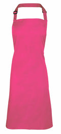 Introducing the Premier PR150: a versatile pink apron equipped with a neck strap and adjustable buckle, perfect for kitchen tasks or arts and crafts projects. The apron is featured against a simple white background.