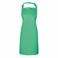 The Premier PR150 green kitchen apron, featuring an adjustable neck strap and waist ties, is showcased on a plain white background.
