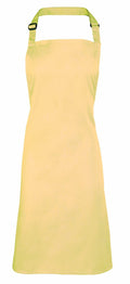 A light yellow apron from Premier, model PR150, is displayed against a white background. It features a neck strap and boasts a simple, classic design with no visible patterns or embellishments.