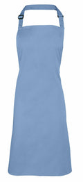 A plain light blue apron from Premier, model PR150, featuring an adjustable neck strap and a simple design, photographed against a white background.