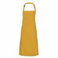 Displayed on a white background is the Premier PR150 apron in mustard yellow, featuring an adjustable neck strap. This apron showcases a simple, classic design with a smooth fabric texture, making it ideal for cooking or crafting activities.