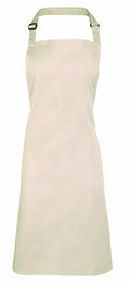 A Premier PR150 apron in a simple, light beige design with an adjustable neck strap is displayed against a white background.
