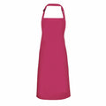 The Premier PR150 apron features a vibrant pink hue with an adjustable neck strap and an extended body design. It is devoid of patterns or pockets, making it ideal for cooking or crafting activities.