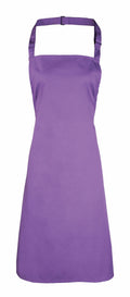 The Premier PR150 is a solid purple apron featuring an adjustable neck strap and waist ties, perfect for kitchen or crafting activities.